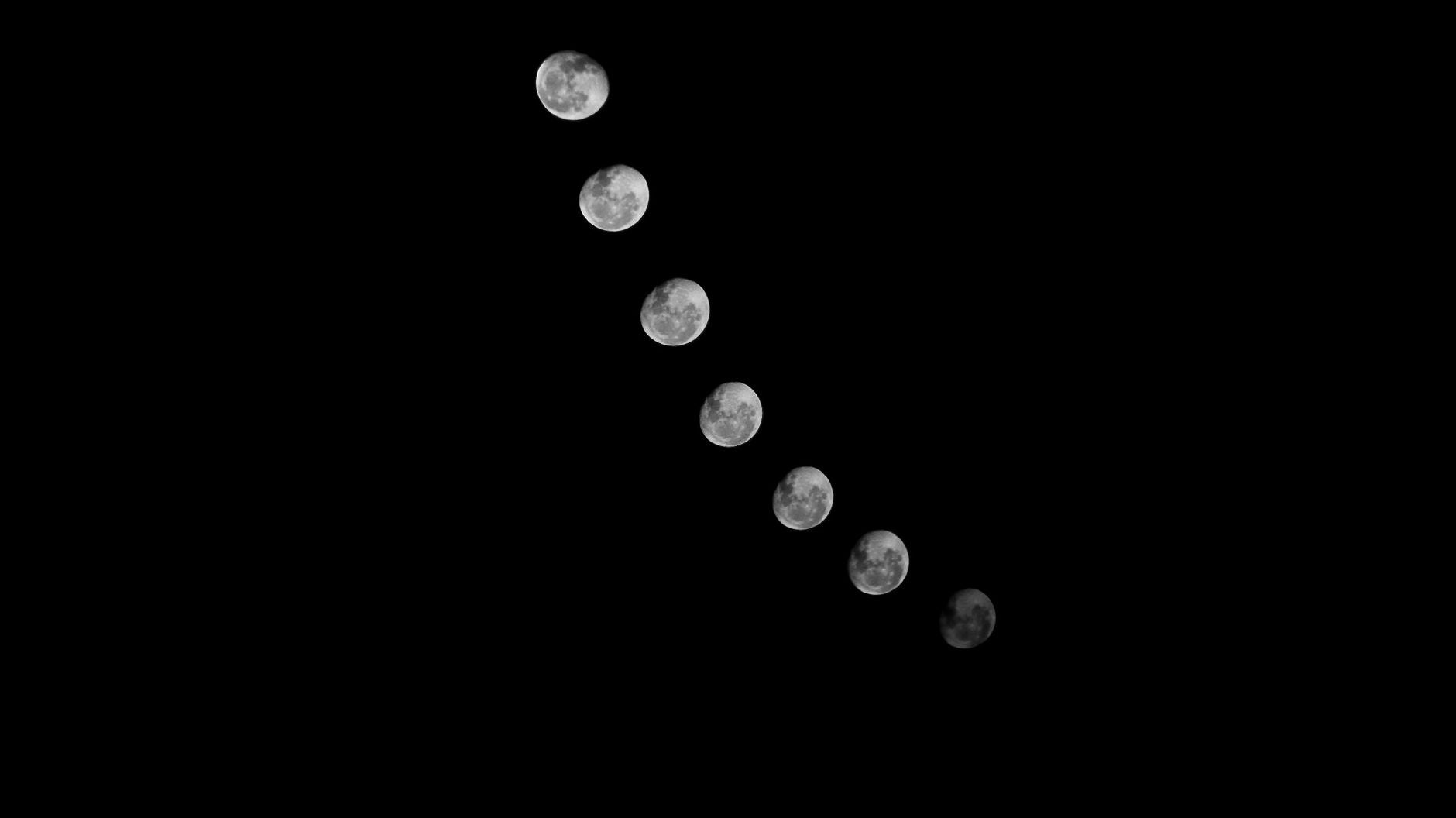 Eight phases of the moon arrayed over a dark sky — the lunar operating clock