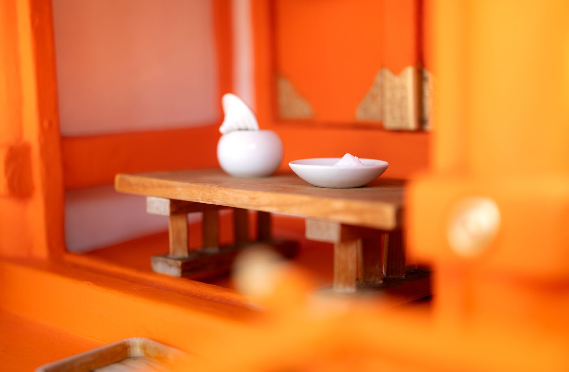 A small offering dish on an altar, representing reciprocity in spiritual practice