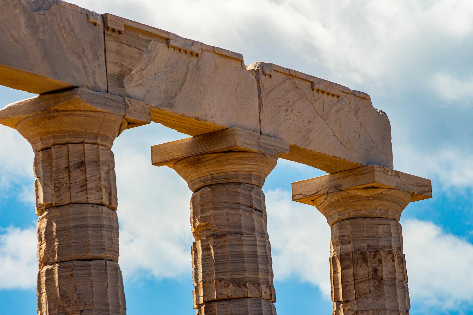 Classical Greek columns under a blue sky, the roots of the Hermetic tradition