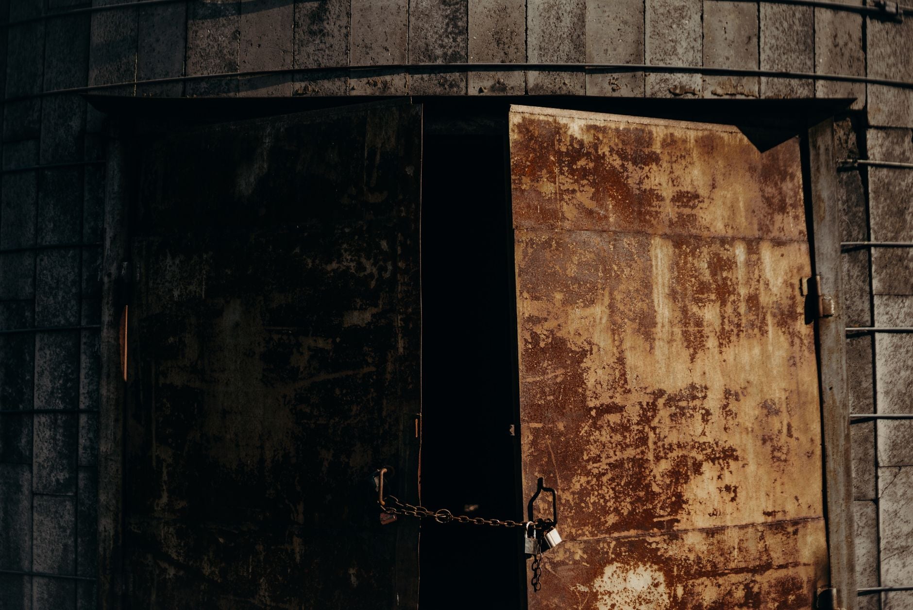 Metal doors with chain and padlock, barrier between analytical mind and operative layer, sigil mechanism