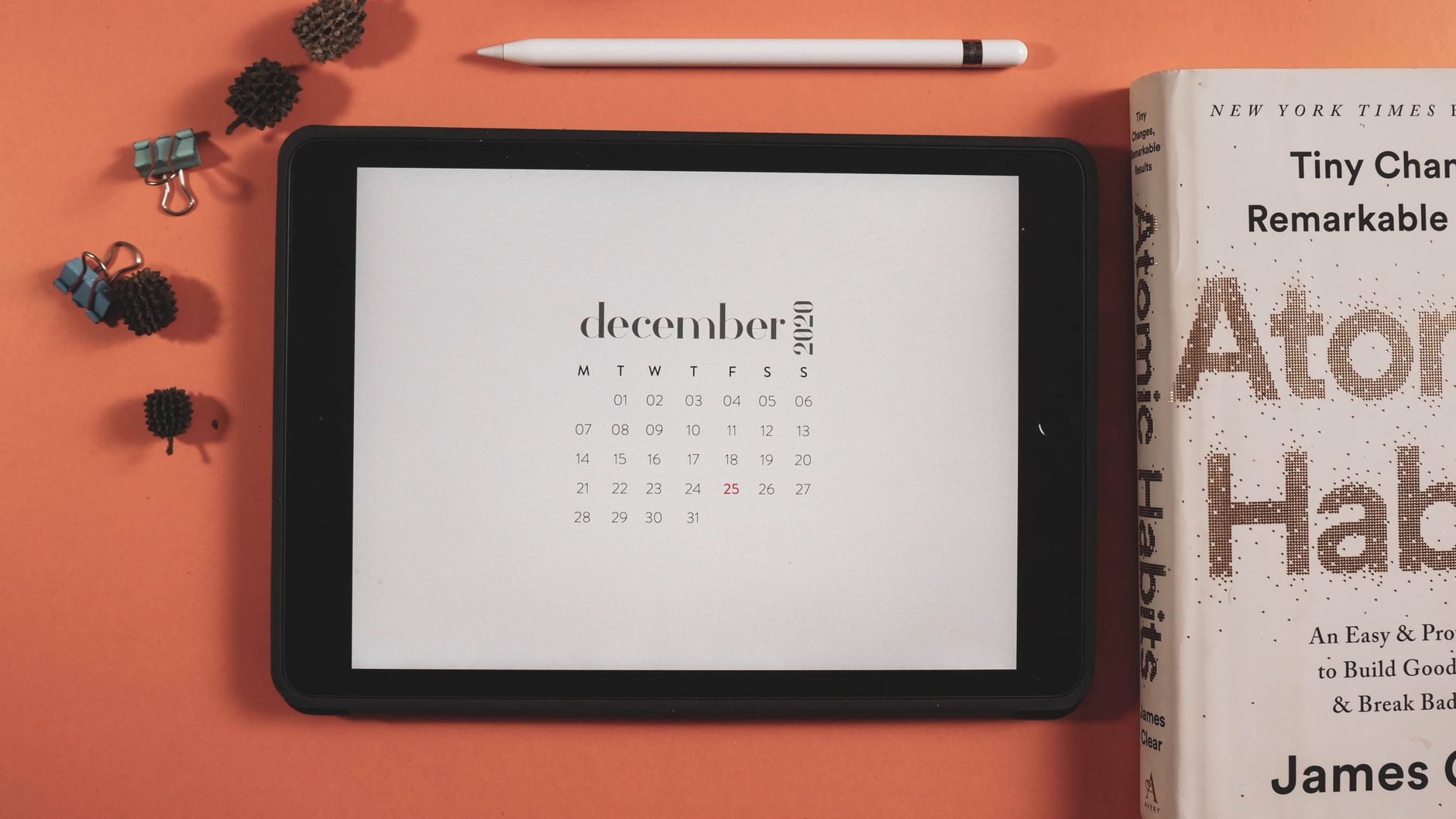 Open notebook on calendar — daily spiritual practice consistency log