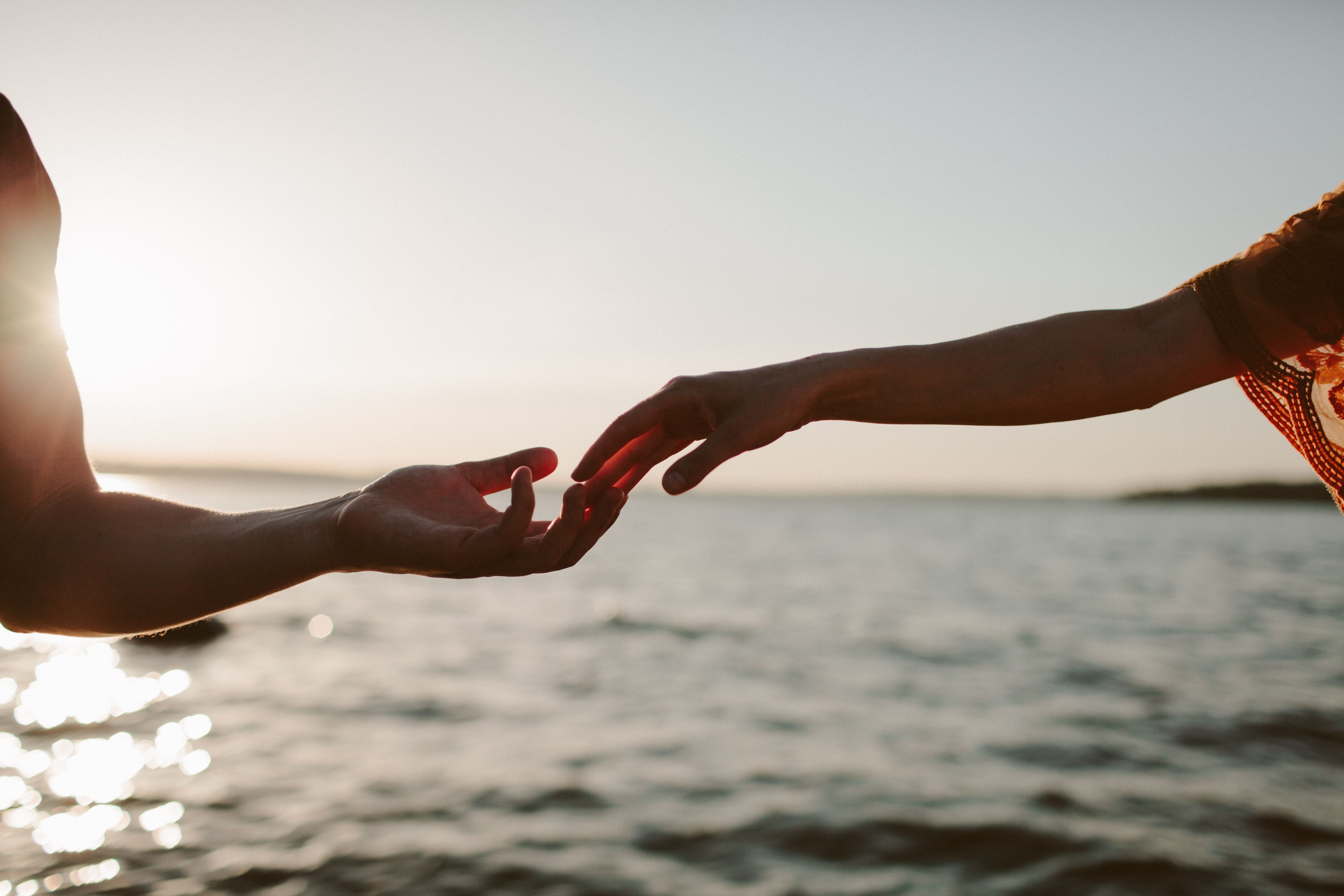 Two luminous threads crossing in dark space — past-life connection and soul agreements