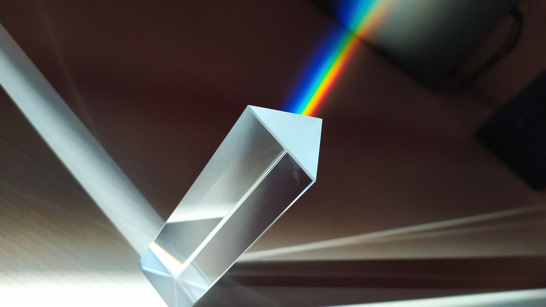 Abstract light refraction illustrating the convergence of Hermetic philosophy and modern physics