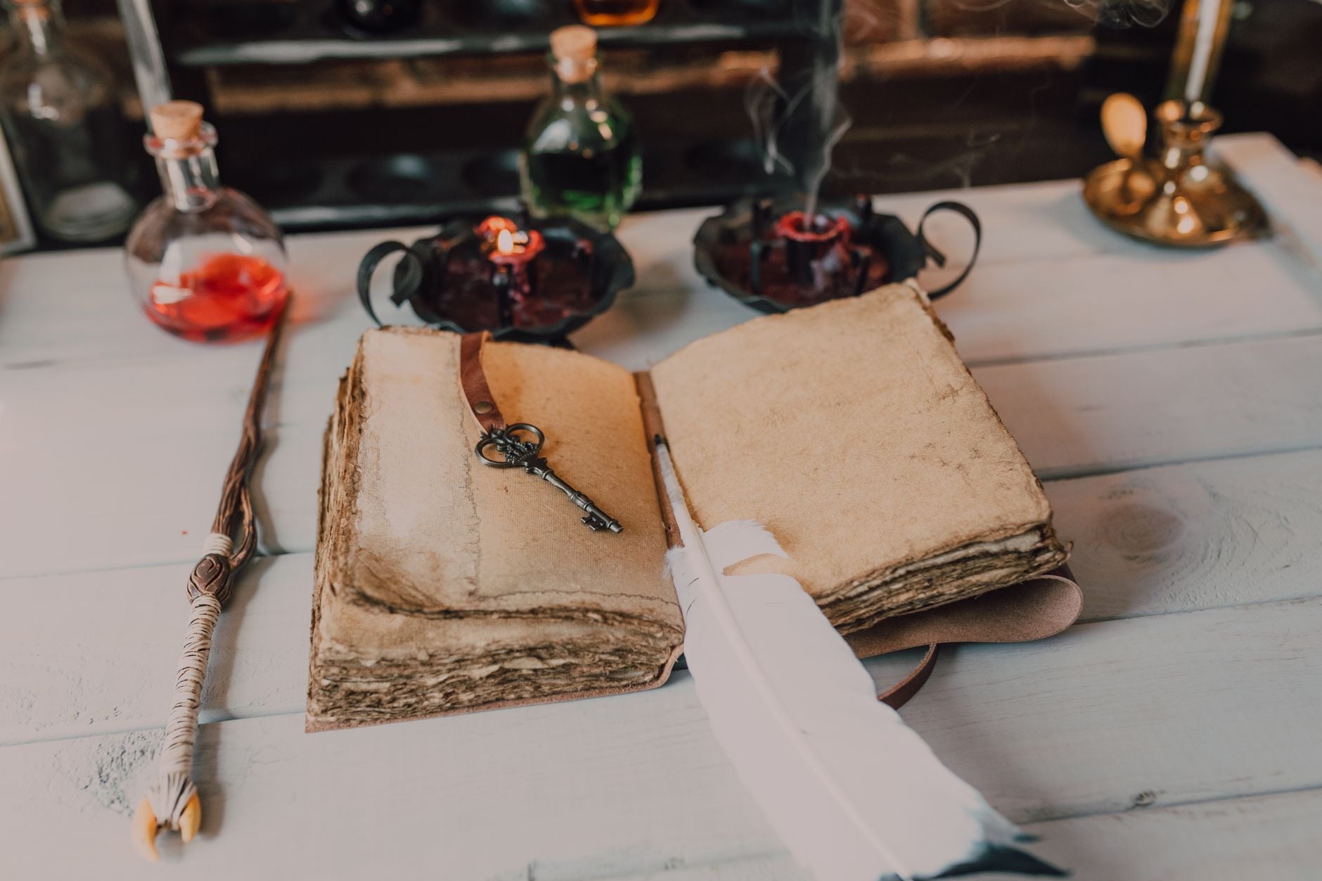 Open hermetic grimoire and ritual implements by candlelight, the classical study layer of the work