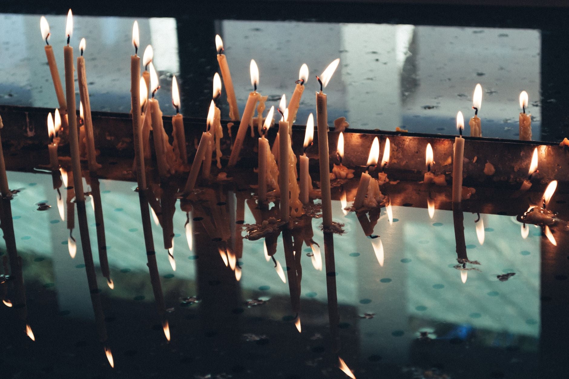 Reading Signs After a Ritual — lit candles burning down in the days after a ritual, marking the response window