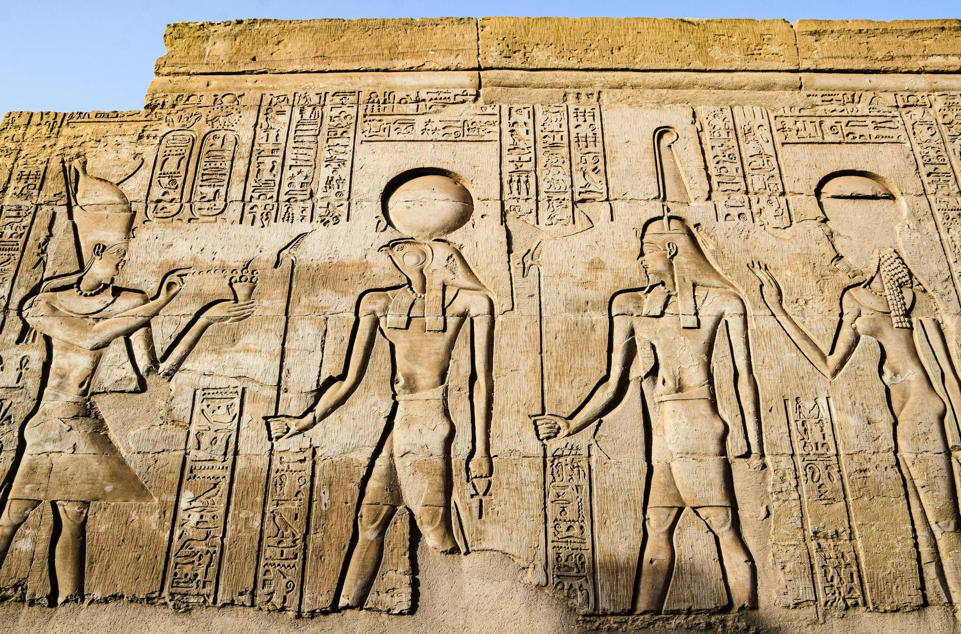 Ancient wall reliefs and hieroglyphs depicting a creation account, the shared myth across cultures