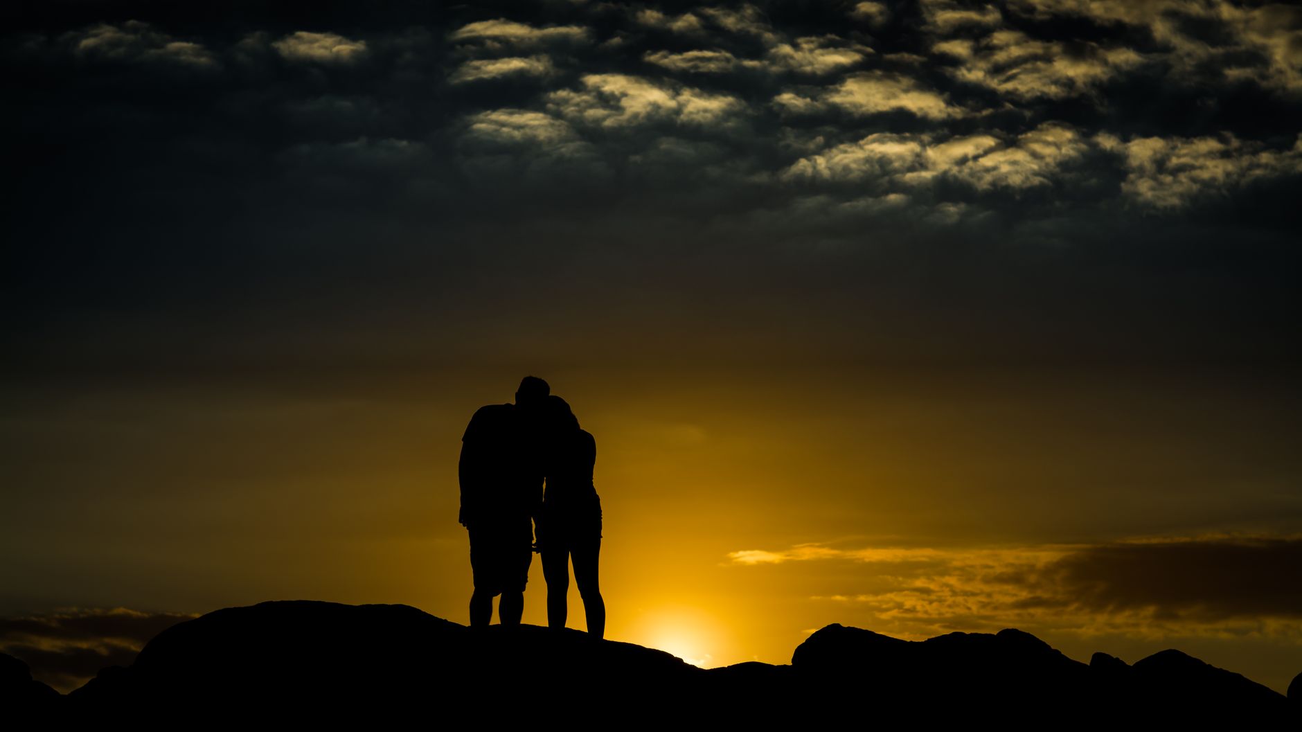 Two figures in silhouette at a distance, the recurring relationship configuration