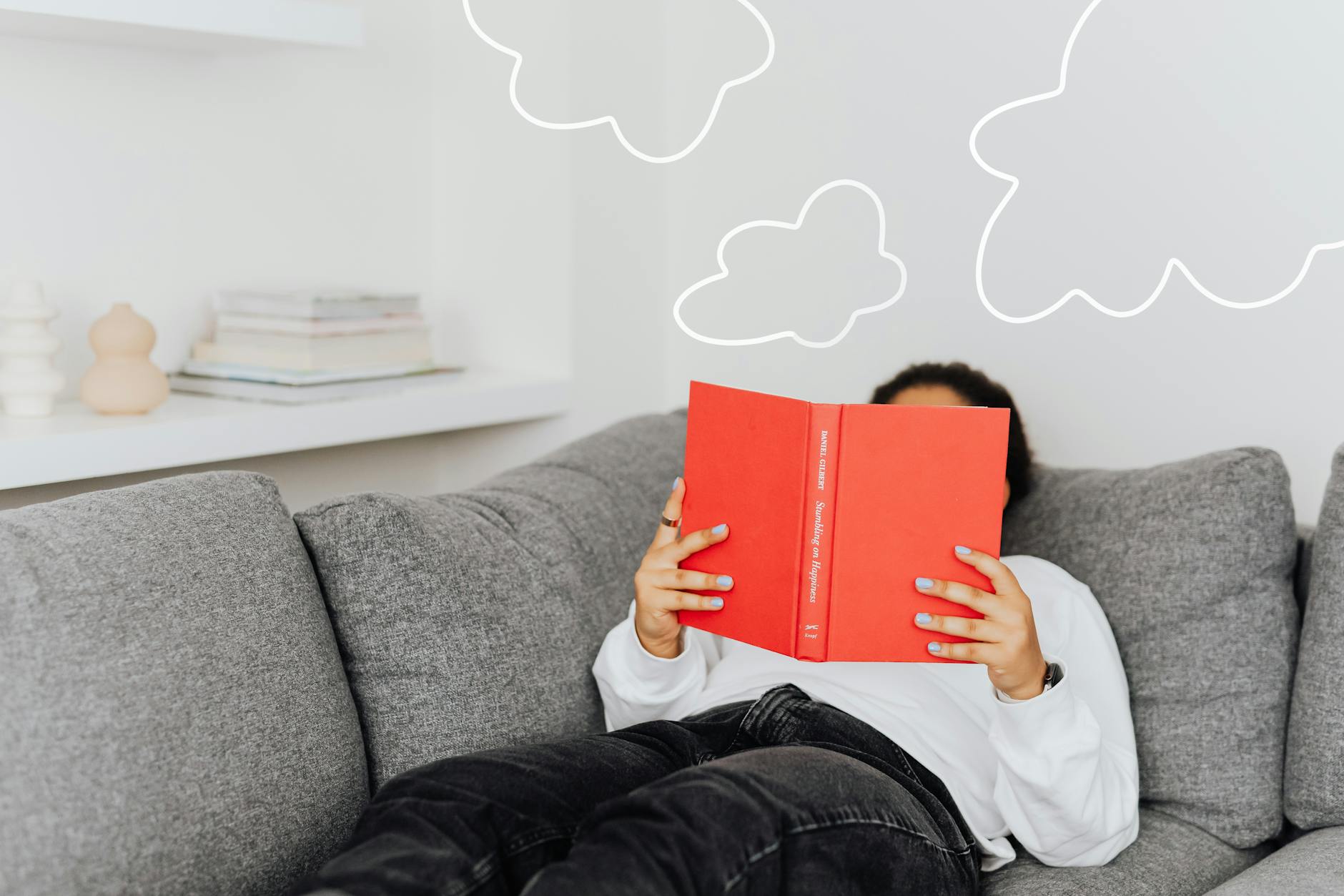 A person resting on a sofa, the parasympathetic down-regulation that defines relaxation