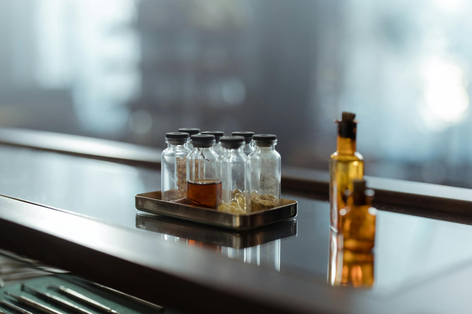 Glass vessels on a table, the alchemical work that underlies the Magnum Opus